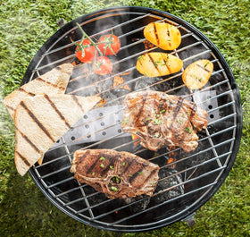 Lightique smoker box on grill during use for smoky flavor