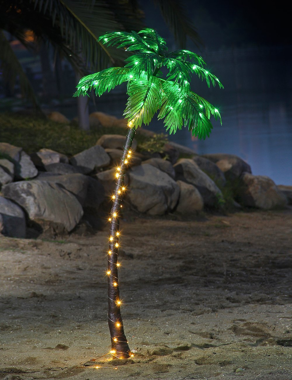 Lightshare palm tree leaves glow brightly with LED accents for outdoor ambiance.