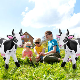 Liliful inflatable cow includes rope and stake to minimize wind drift.
