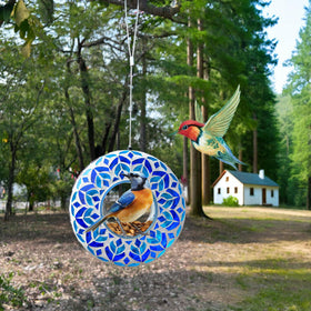 Lily's Home garden decor bird feeder blends art and wildlife habitat outdoors.