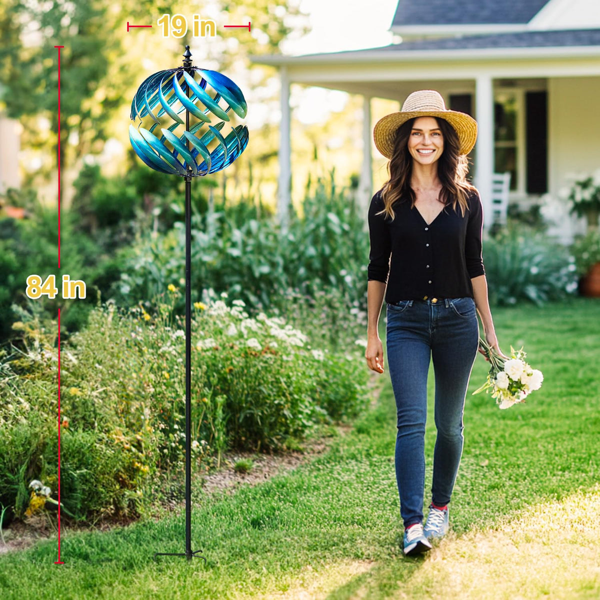 LimeHill wind spinner kinetic metal sculpture showcases detail and movement in garden.