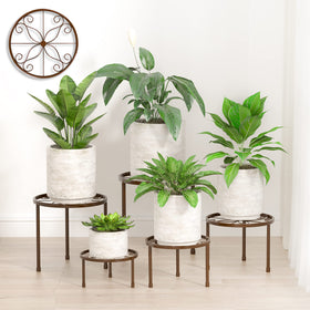 Linpla bronze plant stands with top guard rails for secure pots.