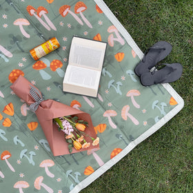 Little Unicorn blanket features exterior zipper pocket for quick storage.