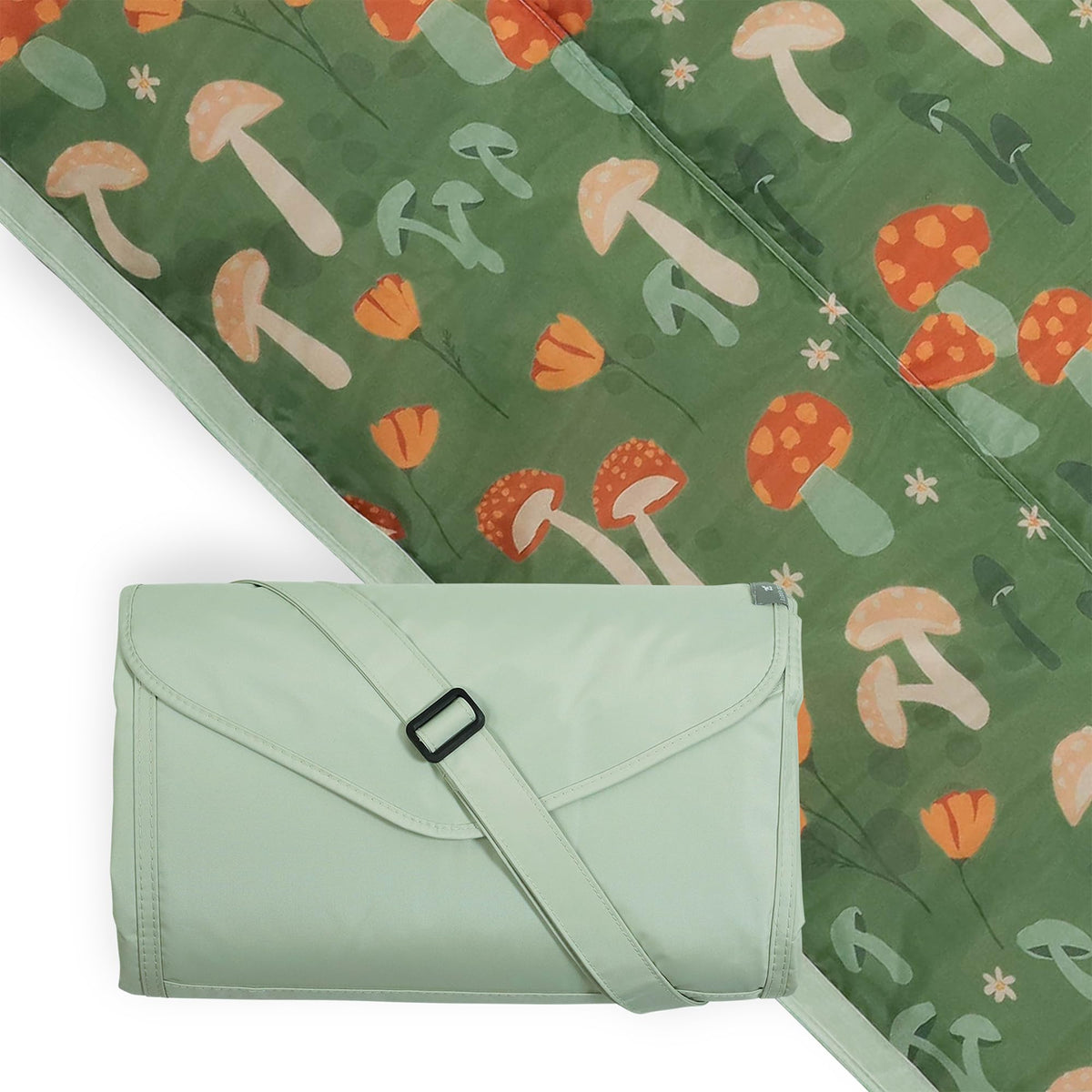 Little Unicorn outdoor blanket folded for compact, portable use.