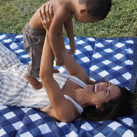 Little Unicorn picnic blanket made with durable material for outdoor use.