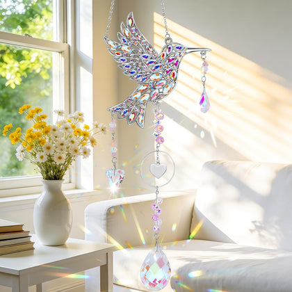 LOKOZ hummingbird sun catcher with crystal prisms sparkling by a sunny window.