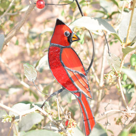 Lolitarcrafts cardinal suncatcher with suction cups easy to hang and reposition in a window.