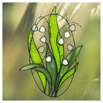 Lolitarcrafts Lily Valley stained glass suncatcher close-up of translucent white bells catching sunlight to brighten rooms