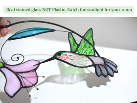 Lolitarcrafts handcrafts stained glass hummingbird on clear sunlit window for warmth