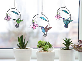 Lolitarcrafts green hummingbird window hangers with flower details catch the light