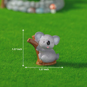 LONCESS koala figurine lying on its side for relaxed garden displays.