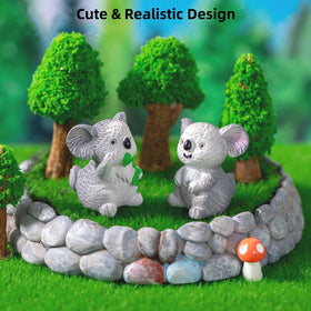LONCESS koala figurine touching its stomach for cozy desktop decor.