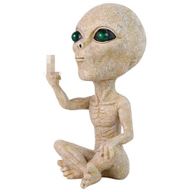 Lopoti Solar Light Alien Statue placed in an outdoor garden setting.