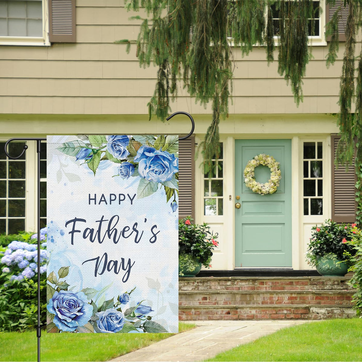 Louise Maelys blue floral rose pattern flag enhances garden charm.