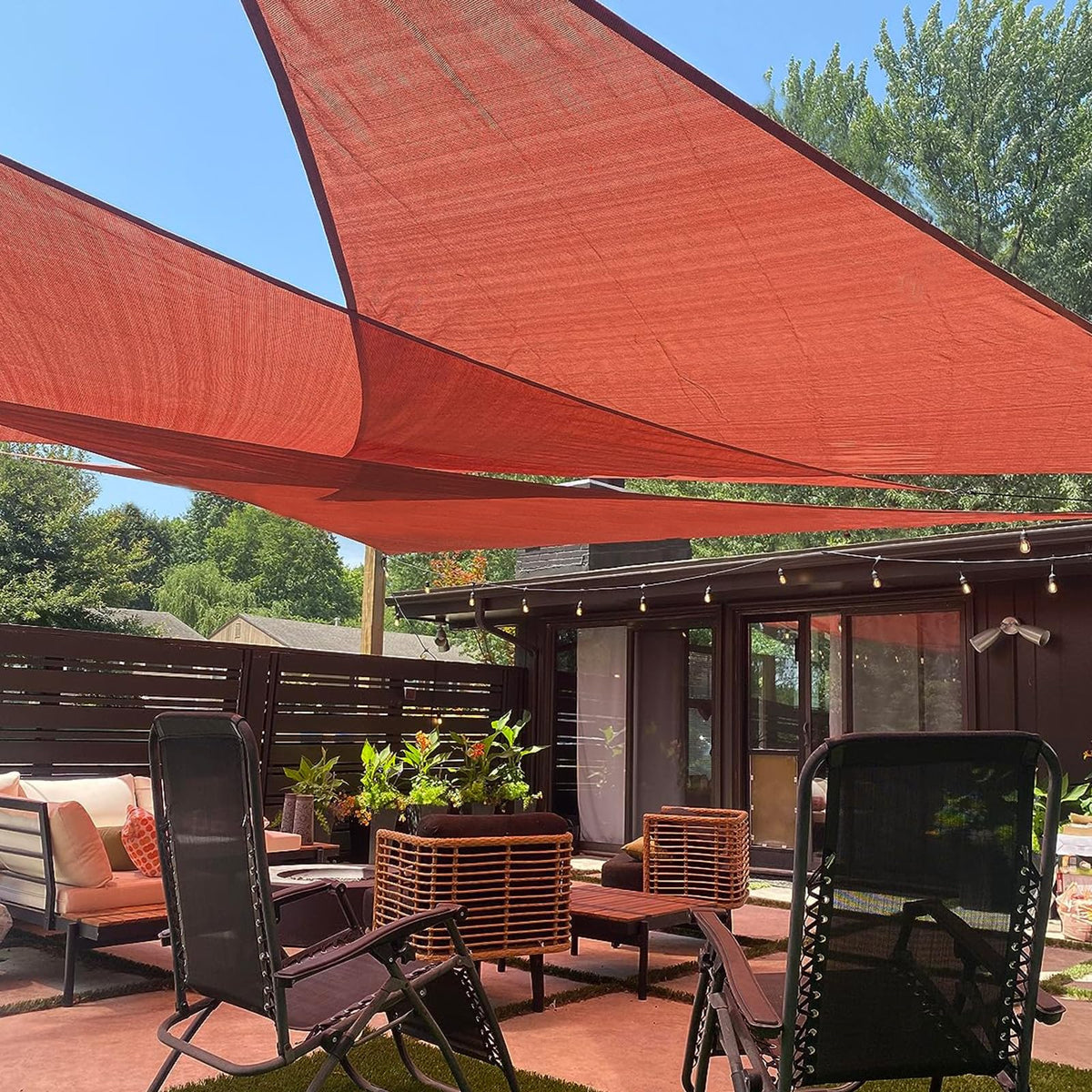 LOVE STORY Terra Red right triangle shade sail over sunlit patio for cool shade
