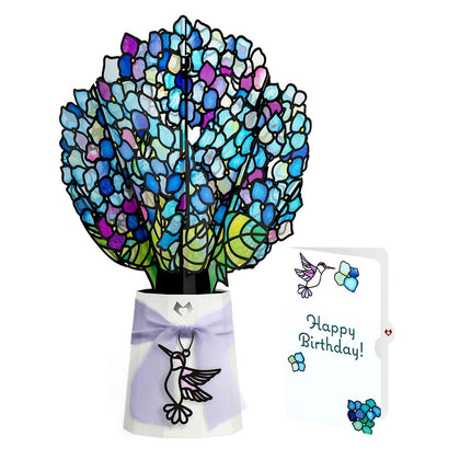 Lovepop birthday suncatcher bouquet glows softly as a desk centerpiece.