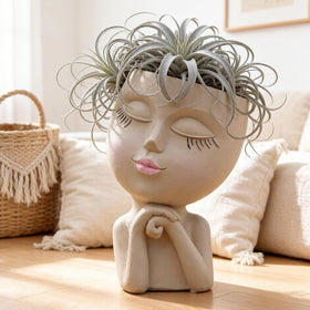 LovTocTic hand-finished resin planter is durable and lightweight.