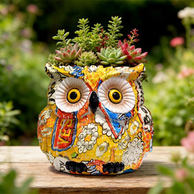 LovTocTic owl planter with succulent display in bright room.