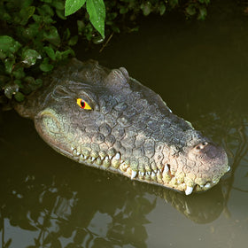 LUEUR floating gator head safely drifts to deter invasive birds in outdoor spaces.