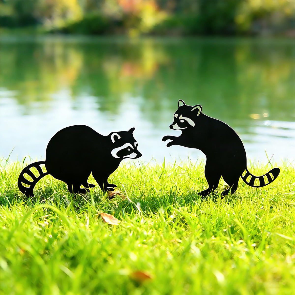 Lume Cradle raccoon stake decorates a garden path with whimsy.