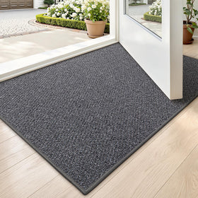 LUMI Ultra Thin Door Mat at entrance with a low profile for smooth door clearance.