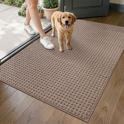LUMI washable door mat in beige at indoor entrance showing absorbent grid texture