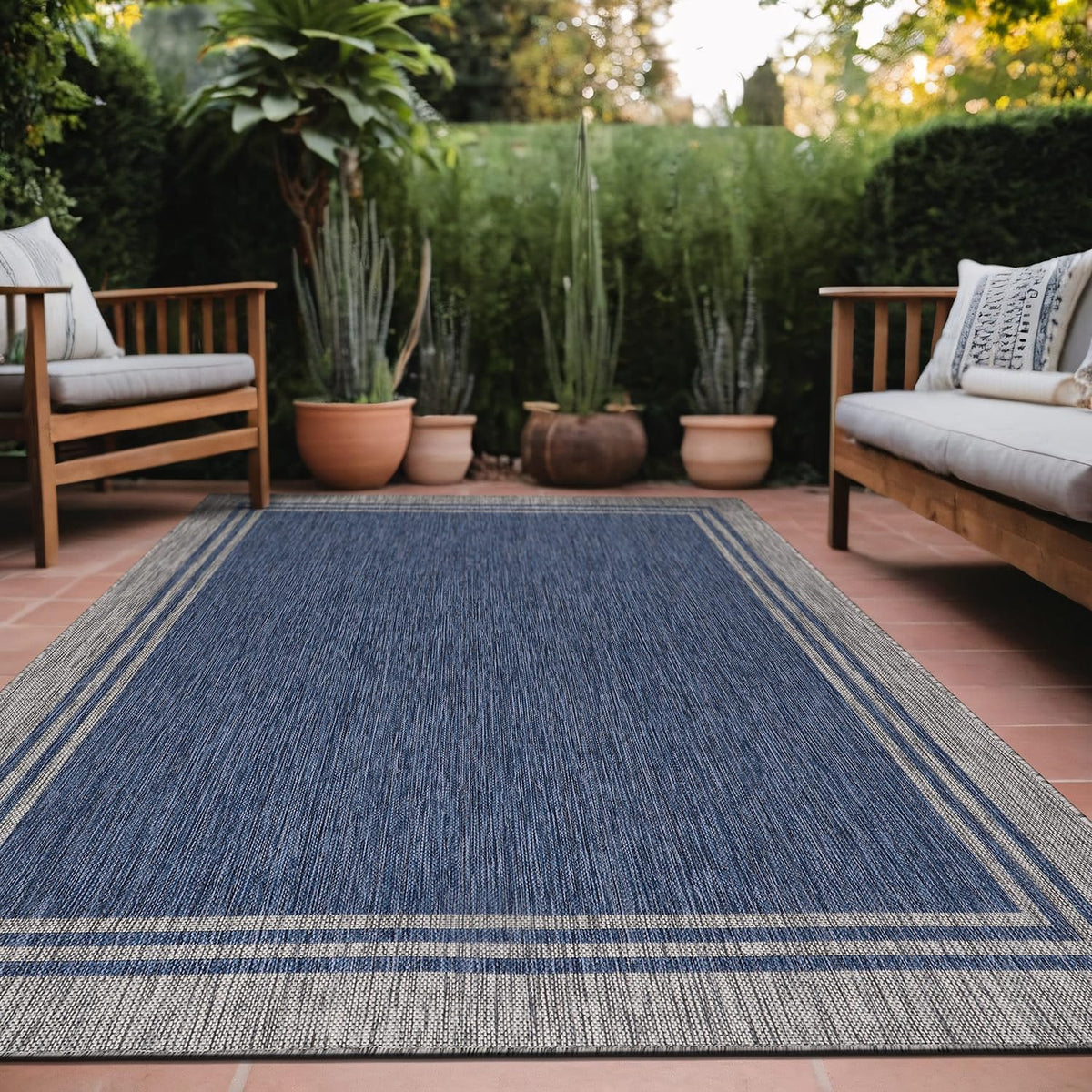 Luul Home bordered outdoor rug 6x9 navy border ideal for patios and entryways.