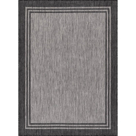 Luul Home bordered outdoor rug 9x12 on deck with UV resistance and durability.