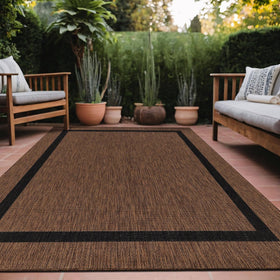 Luul Home bordered outdoor rug 9x12 on patio, durable border design.