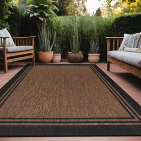 Luul Home bordered outdoor rug 8x10 on patio adds style while remaining washable.