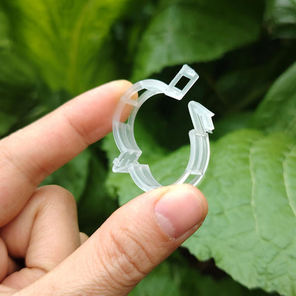 Luxdesc plant support clips package with 50 translucent, reusable clips for stems and vines.