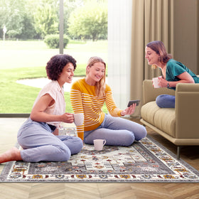 LuxStep rug near entryway with hose rinse demonstrates simple cleanup after outdoor use.