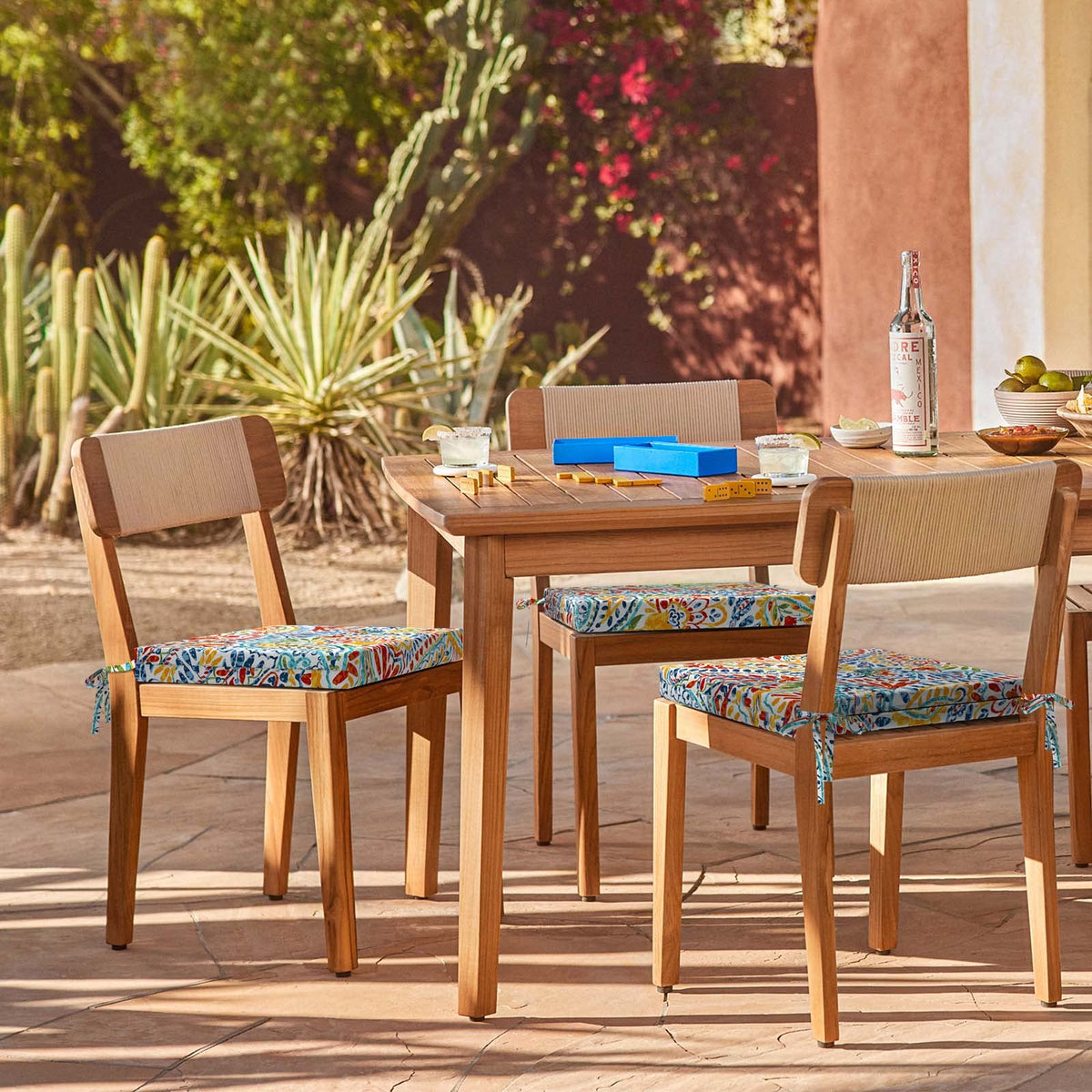 Balcony dining setup featuring LVTXIII outdoor cushions