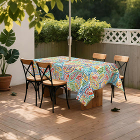 Patio dining setup featuring LVTXIII tablecloth on an oblong table.