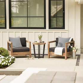 LVTXIII strip-grey outdoor-pillow on chair demonstrates 18x18 size for balanced look.