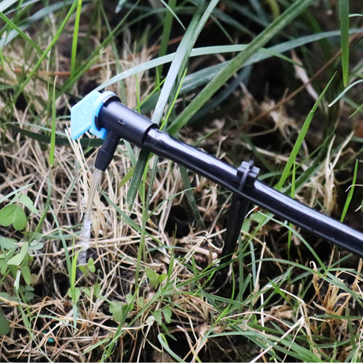 Lxcom Lighting blue drip emitter assembly designed for easy cleaning