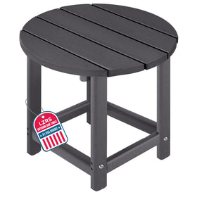 LZRS round Adirondack side table in grey beside a chair on a sunny patio.