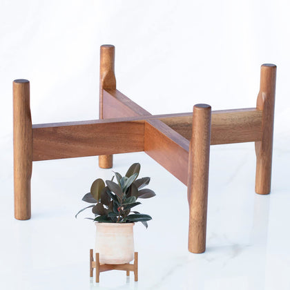 Macaw on Kapok wood plant stand supports 8-14 inch pots for stylish indoor display.