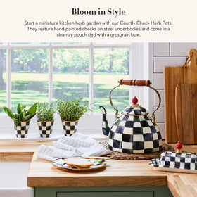 MacKenzie-Childs Courtly Check pattern detail adds black-and-white charm to indoor decor.