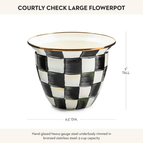MacKenzie-Childs decorative pot on kitchen windowsill decor idea.