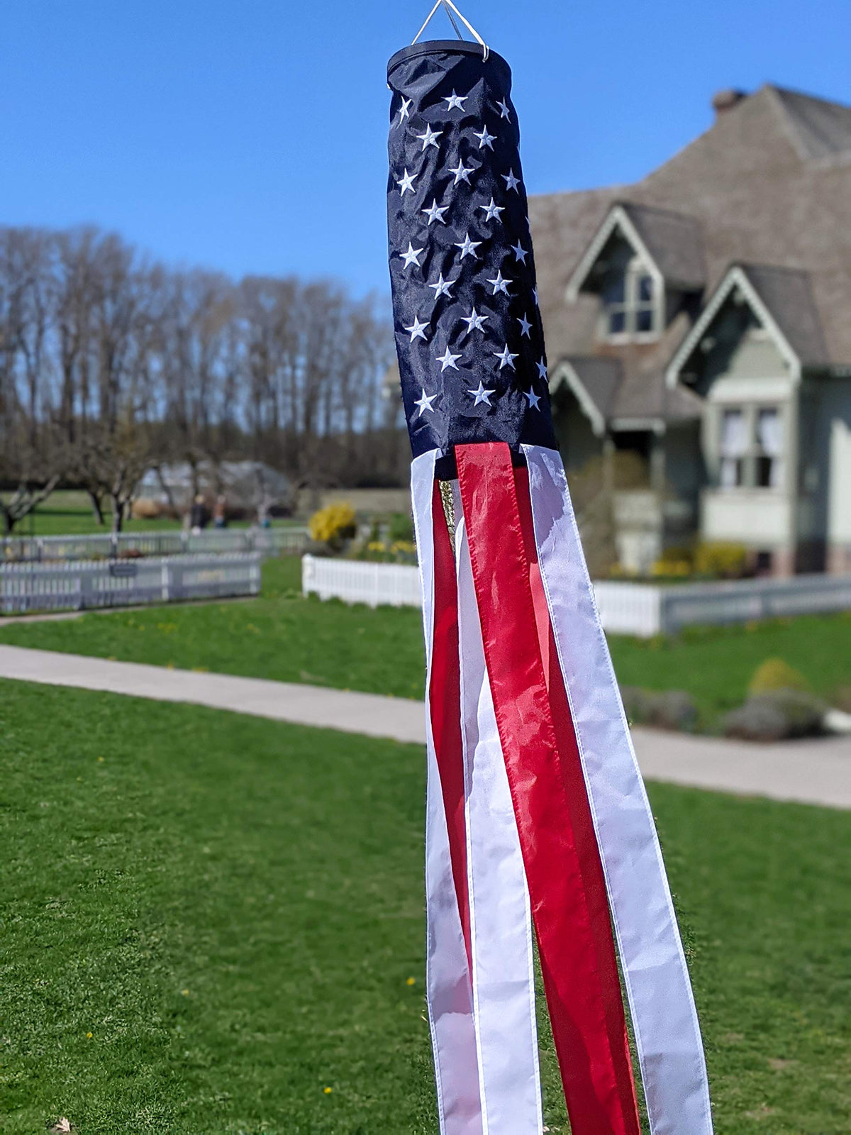 Madrona Brands red and white patriotic tails create motion in breeze.