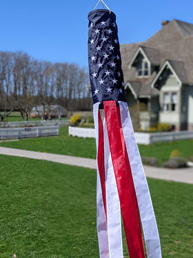 Madrona Brands red and white patriotic tails create motion in breeze.