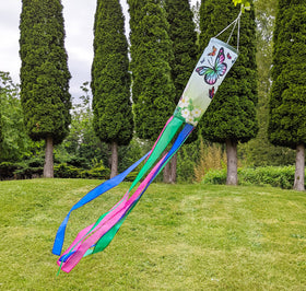 Madrona Brands windsock against green gradient background enhances curb appeal.