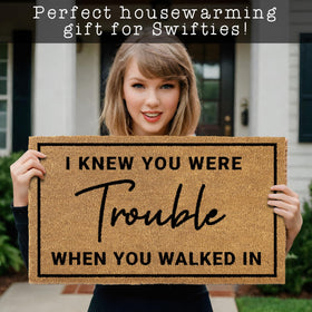 MAINEVENT I Knew Your Were Trouble welcome mat on a covered porch