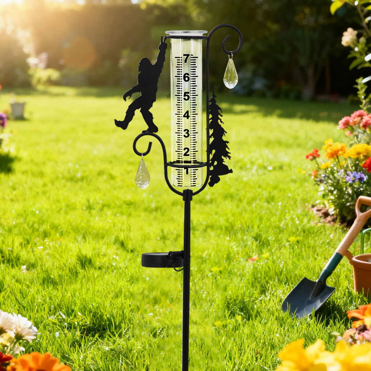 Manortang Sasquatch rain gauge stake with solar light activation at dusk