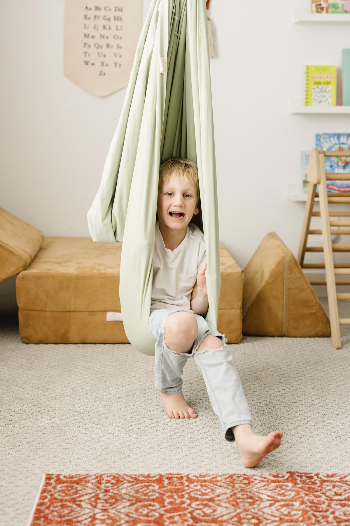 Child seated on the swing demonstrates calming vestibular motion