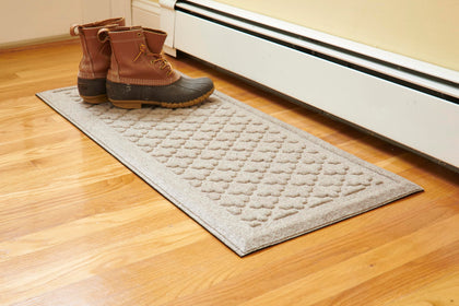 Mats Inc Artisan Entry Boot Tray front view with raised edge containing mud and water.
