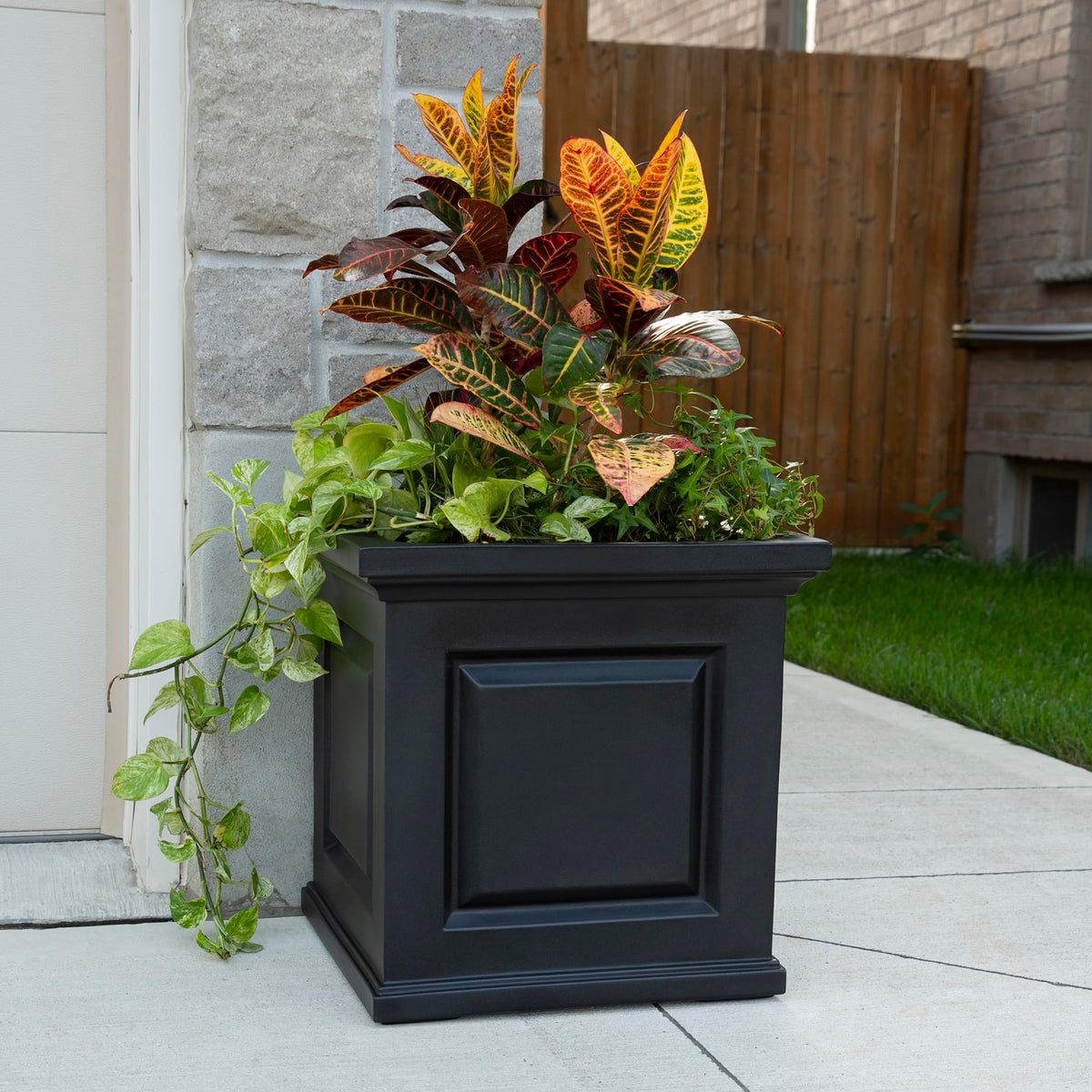 Overflow drainage on Mayne Nantucket planter prevents water buildup and overwatering.