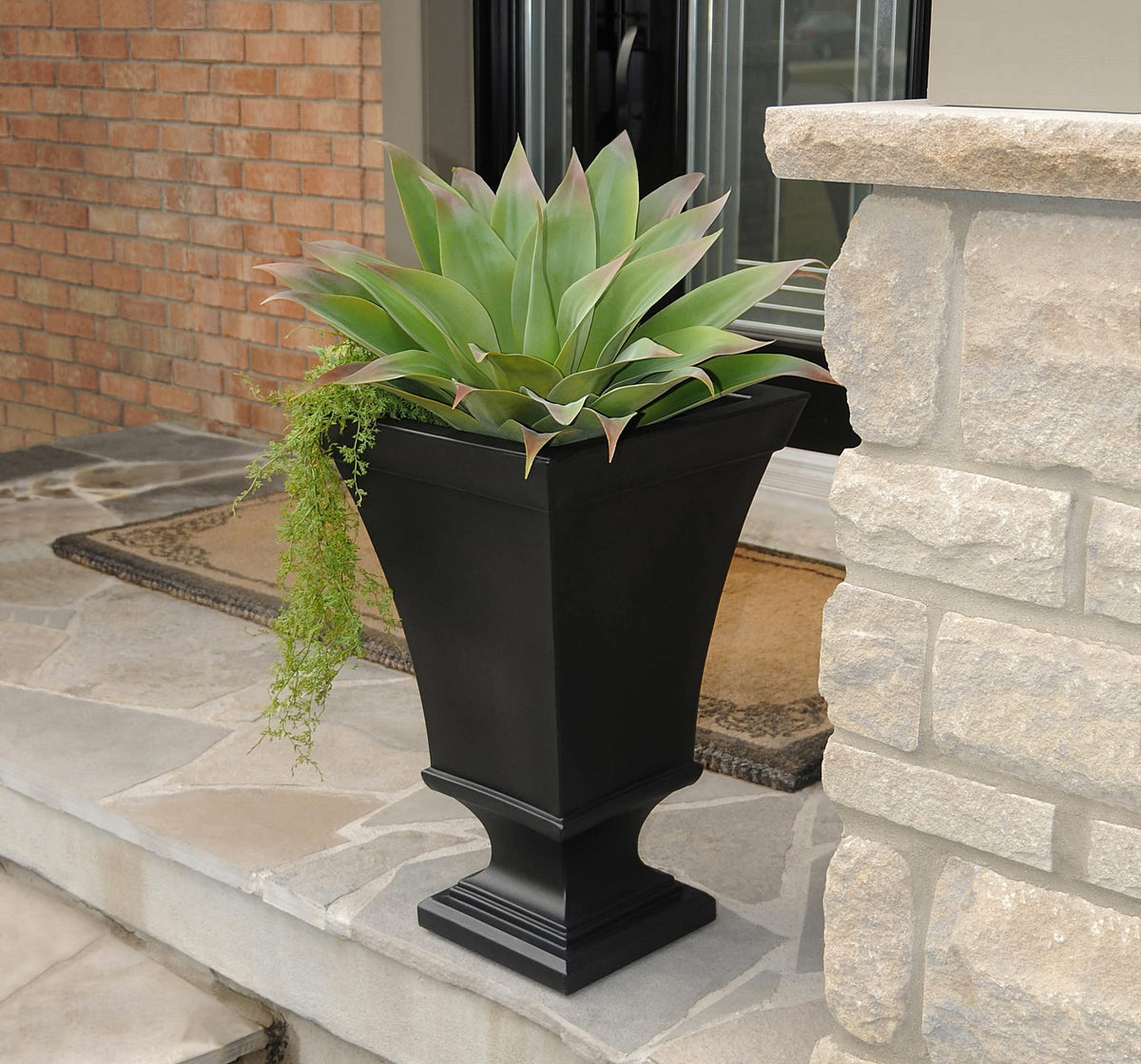 Mayne Vienna black urn planter, reservoir close-up highlighting built-in watering feature.