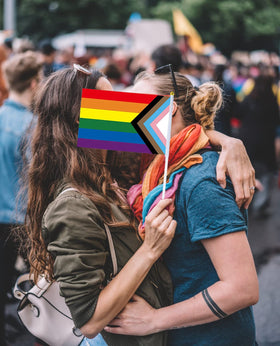 Medoore Progress Pride flag at event adds vibrant color